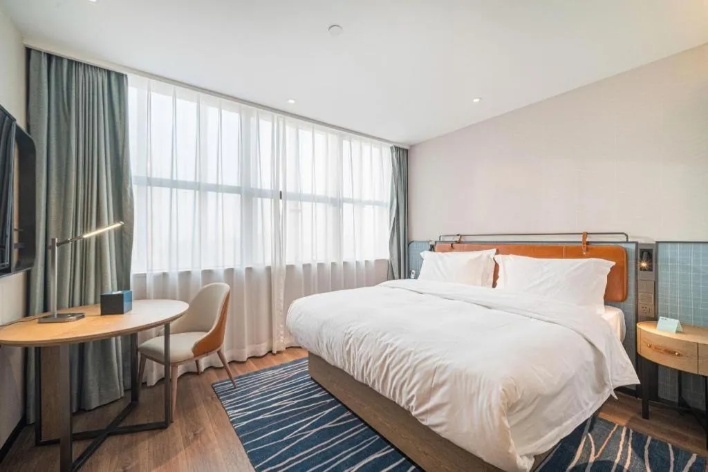 Bed in Echarm Hotel Nanjing Expo Center Olympic East Metro Station