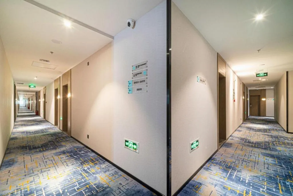 Bed in Echarm Hotel Nanjing Expo Center Olympic East Metro Station