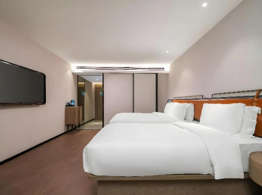 Bed in Echarm Hotel Nanjing Expo Center Olympic East Metro Station