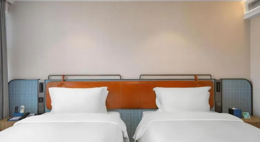 Bed in Echarm Hotel Nanjing Expo Center Olympic East Metro Station