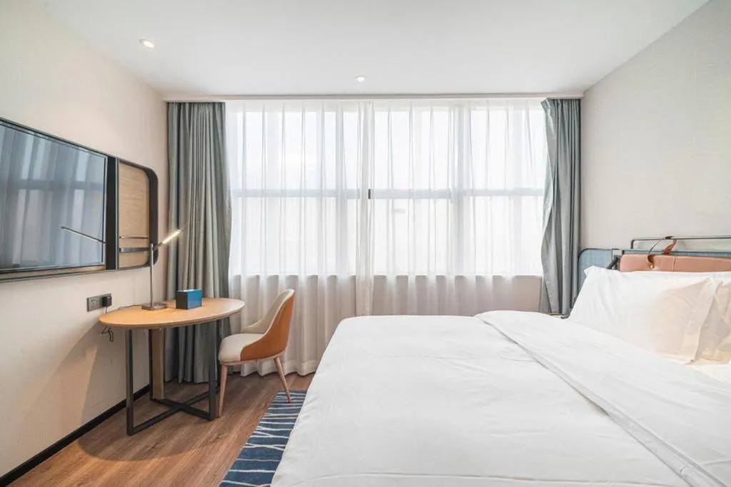 Bed in Echarm Hotel Nanjing Expo Center Olympic East Metro Station