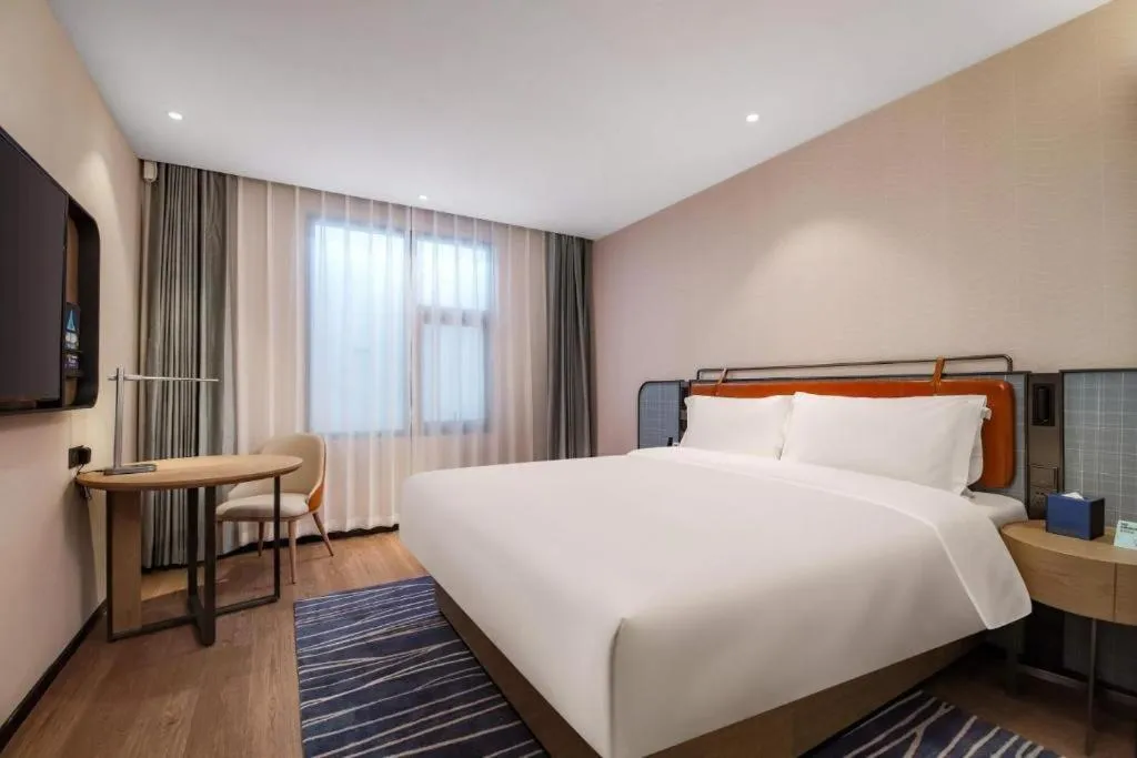 Bed in Echarm Hotel Nanjing Expo Center Olympic East Metro Station