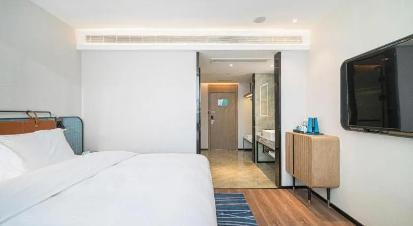 Bed in Echarm Hotel Nanjing Expo Center Olympic East Metro Station