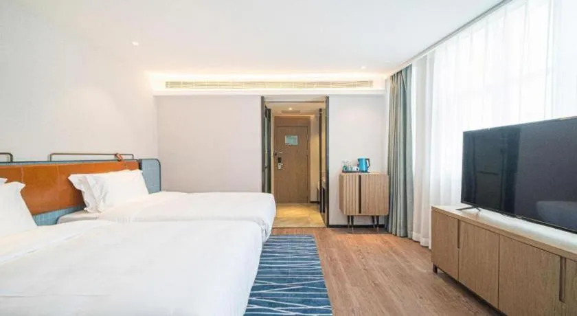 Bed in Echarm Hotel Nanjing Expo Center Olympic East Metro Station