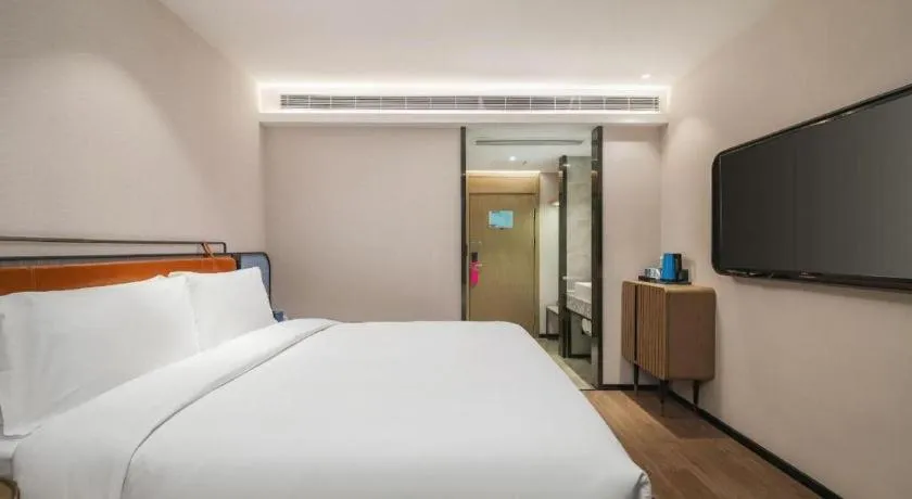 Bed in Echarm Hotel Nanjing Expo Center Olympic East Metro Station