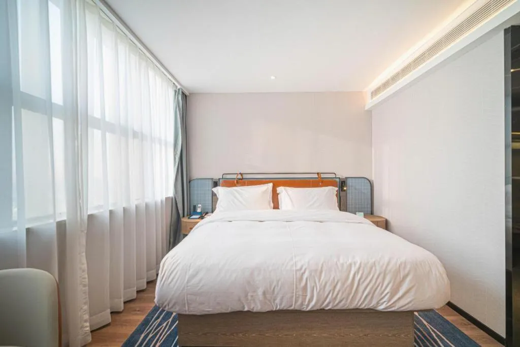 Bed in Echarm Hotel Nanjing Expo Center Olympic East Metro Station