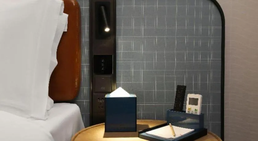 Bed in Echarm Hotel Nanjing Expo Center Olympic East Metro Station