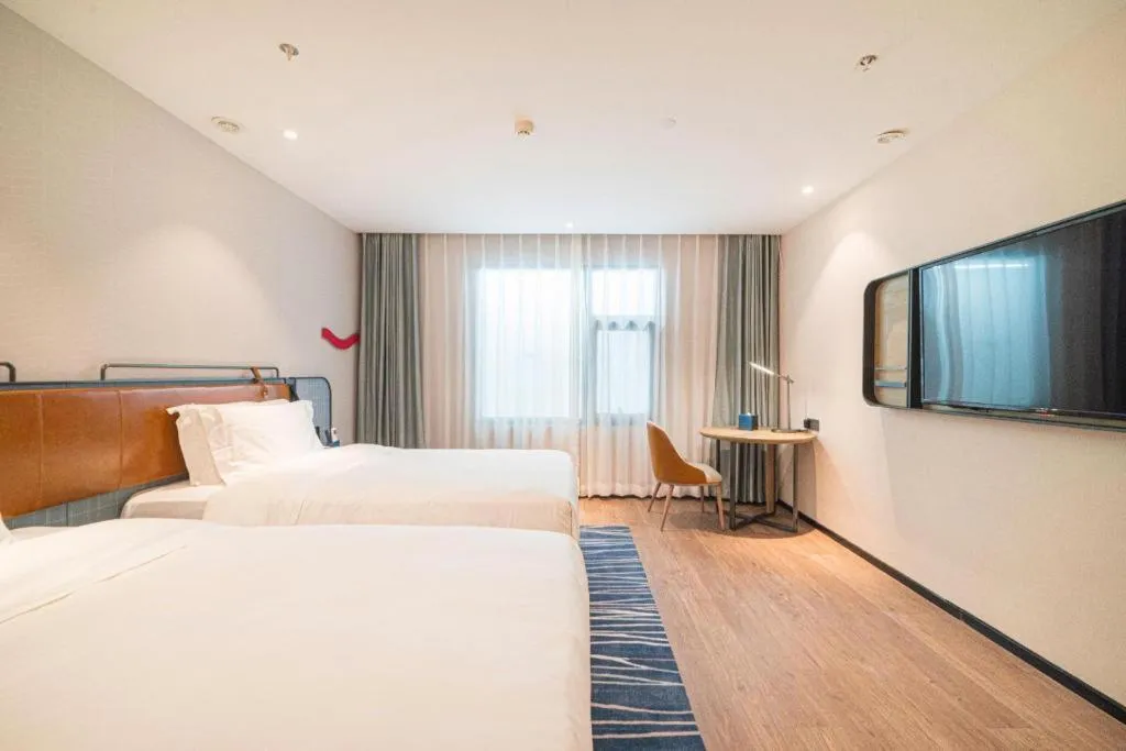 Bed in Echarm Hotel Nanjing Expo Center Olympic East Metro Station