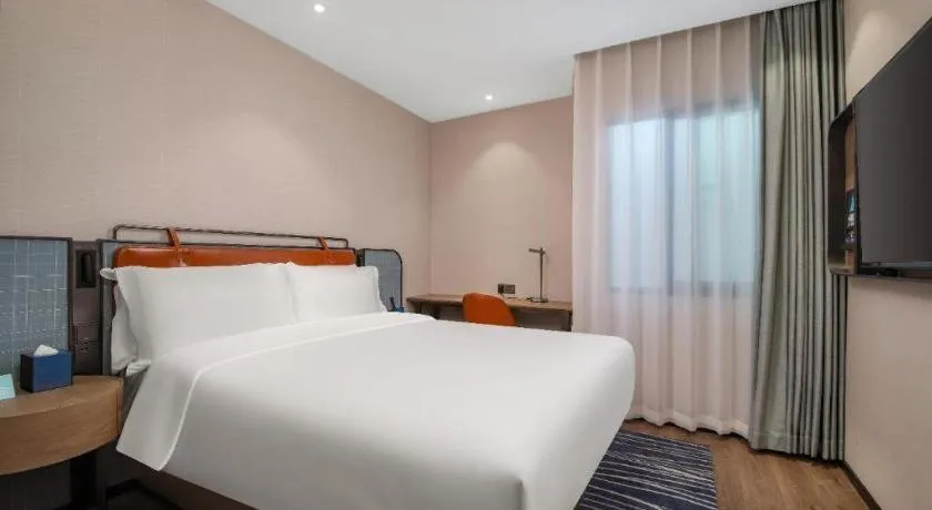 Bed in Echarm Hotel Nanjing Expo Center Olympic East Metro Station