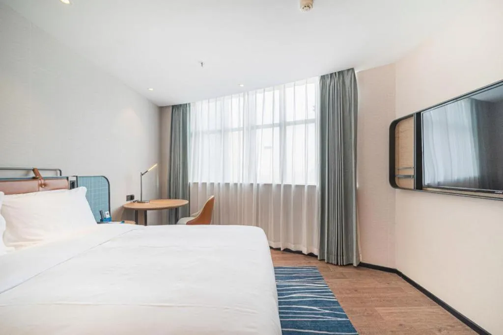 Bed in Echarm Hotel Nanjing Expo Center Olympic East Metro Station