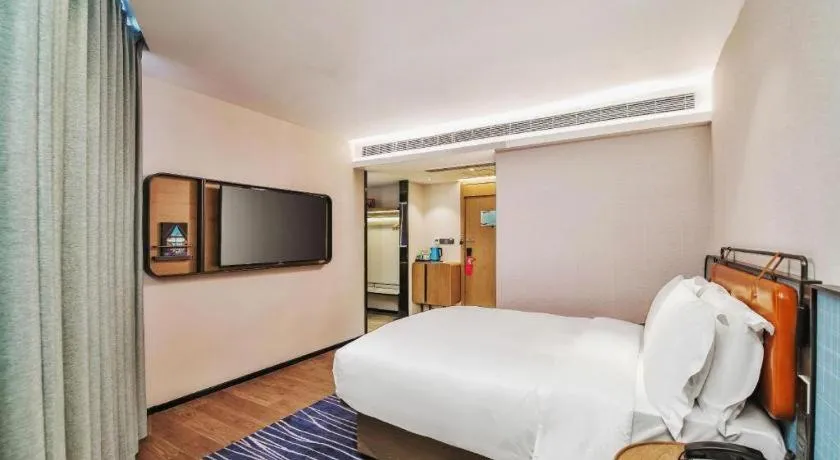 Bed in Echarm Hotel Nanjing Expo Center Olympic East Metro Station