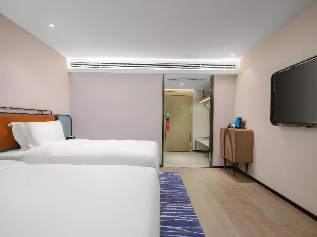 Bed in Echarm Hotel Nanjing Expo Center Olympic East Metro Station