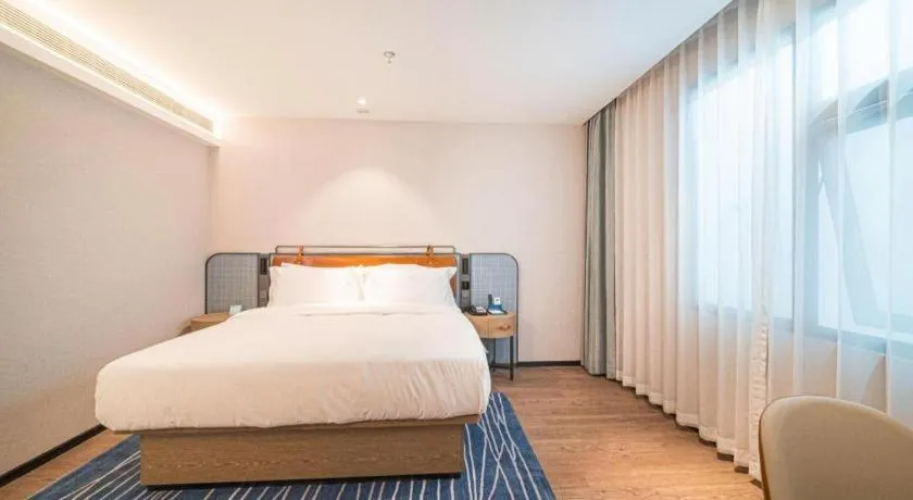 Bed in Echarm Hotel Nanjing Expo Center Olympic East Metro Station