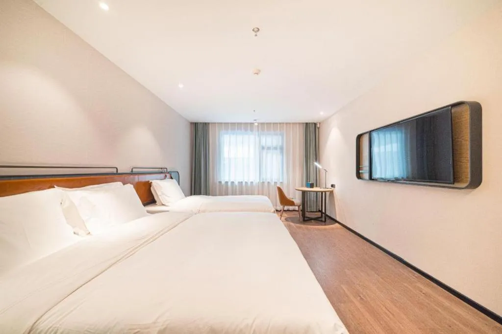 Bed in Echarm Hotel Nanjing Expo Center Olympic East Metro Station