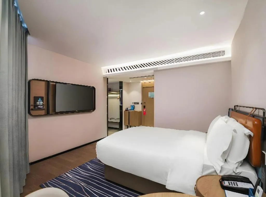 Bed in Echarm Hotel Nanjing Expo Center Olympic East Metro Station