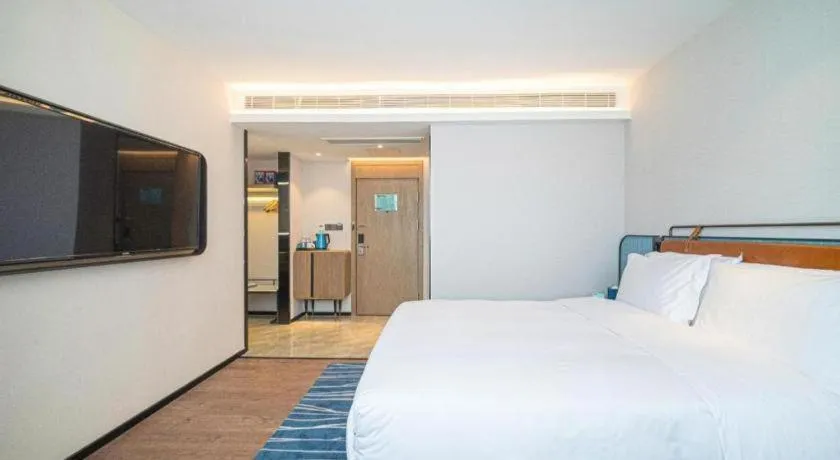 Bed in Echarm Hotel Nanjing Expo Center Olympic East Metro Station