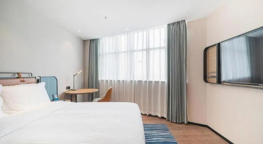 Bed in Echarm Hotel Nanjing Expo Center Olympic East Metro Station