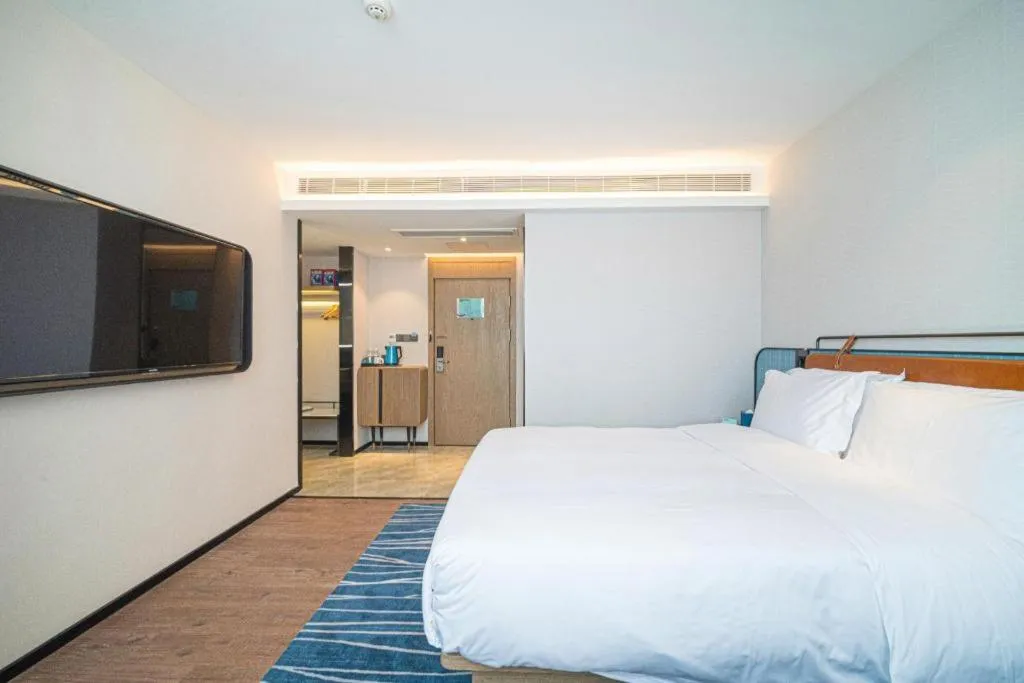 Bed in Echarm Hotel Nanjing Expo Center Olympic East Metro Station