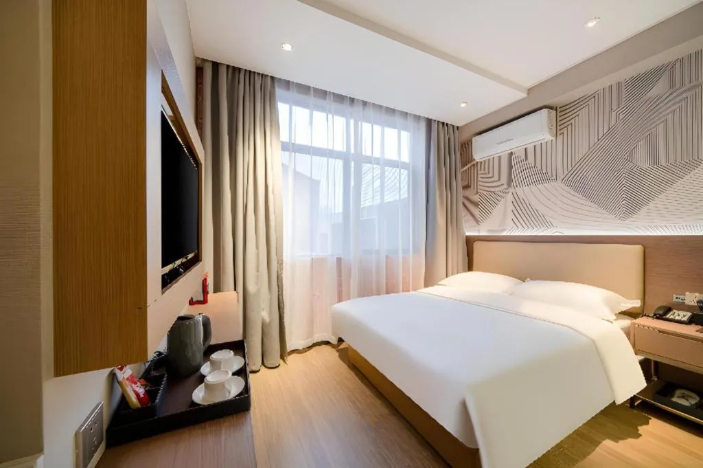 Bed in Borrman Hotel Xiantao Wushang Gymnasium