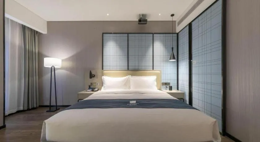 Bed in Echarm Hotel Wuhan Huashan