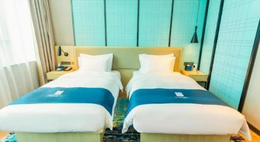 Bed in Echarm Hotel Wuhan Huashan