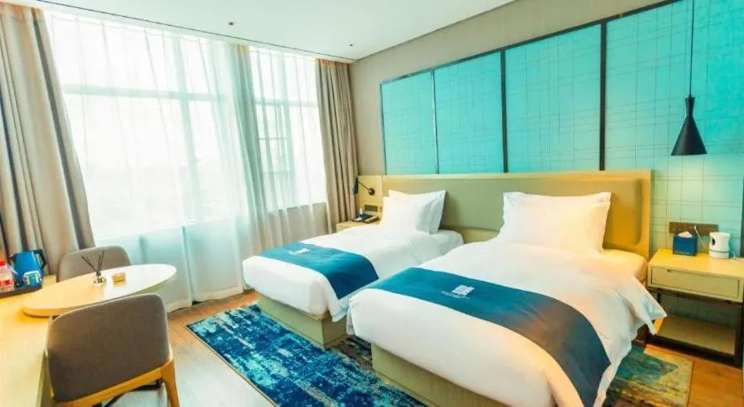 Bed in Echarm Hotel Wuhan Huashan