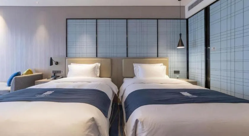 Bed in Echarm Hotel Wuhan Huashan