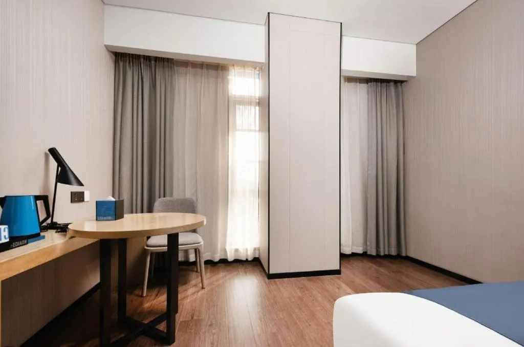 Bed in Echarm Hotel Wuhan Huashan