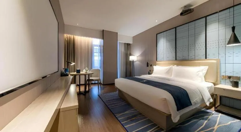 Bed in Echarm Hotel Wuhan Huashan