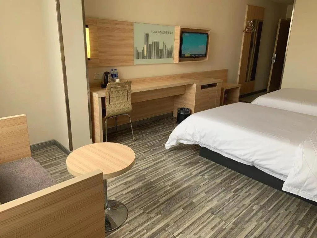 Bed in City Comfort Inn Yichang Wanda Plaza Yunhe Park