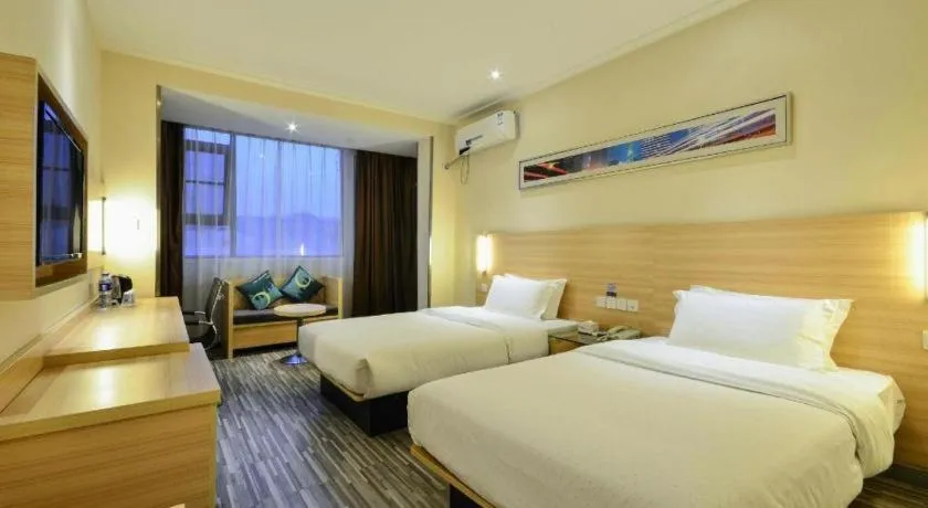Bed in City Comfort Inn Yichang Wanda Plaza Yunhe Park