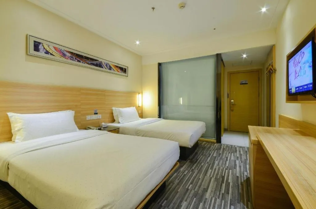 Bed in City Comfort Inn Yichang Wanda Plaza Yunhe Park
