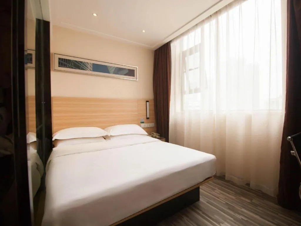Bed in City Comfort Inn Yichang Wanda Plaza Yunhe Park