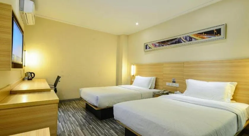 Bed in City Comfort Inn Yichang Wanda Plaza Yunhe Park