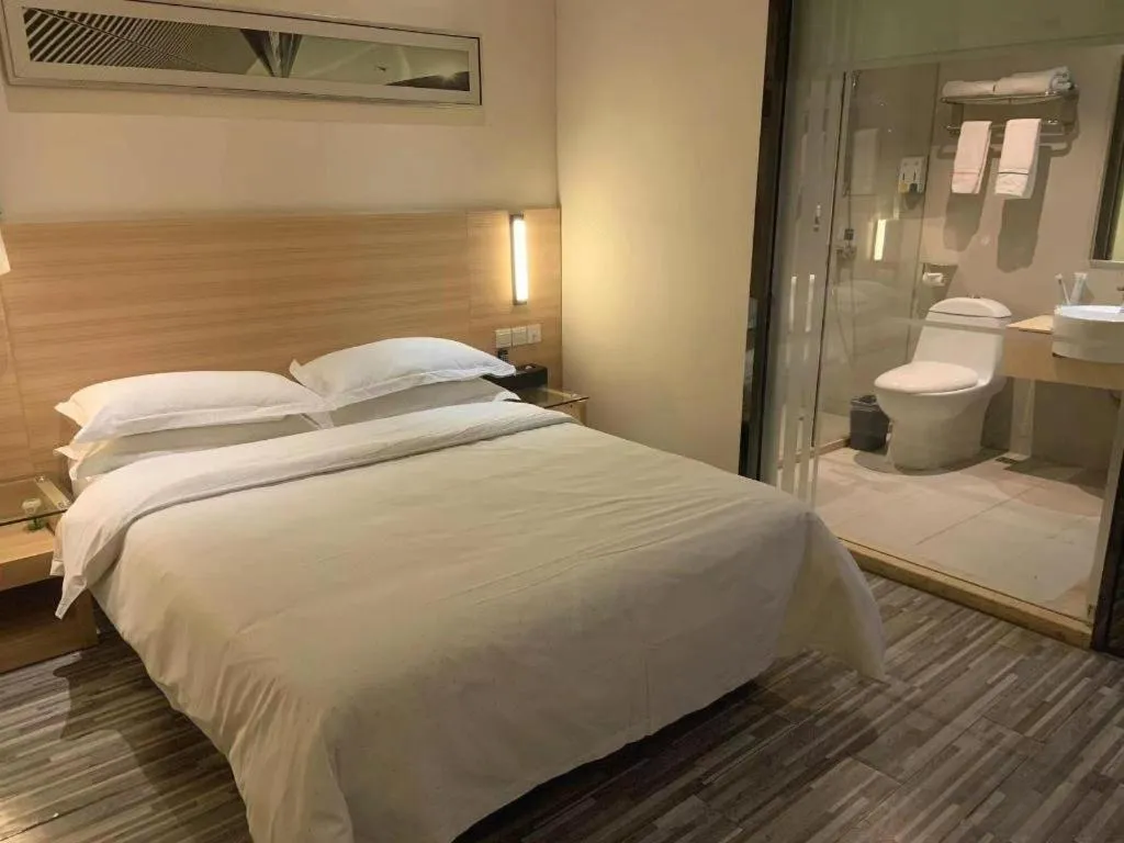 Bed in City Comfort Inn Yichang Wanda Plaza Yunhe Park