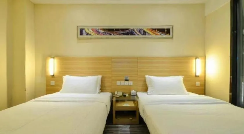 Bed in City Comfort Inn Yichang Wanda Plaza Yunhe Park