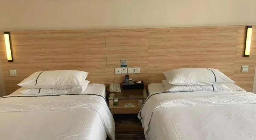 Bed in City Comfort Inn Yichang Wanda Plaza Yunhe Park