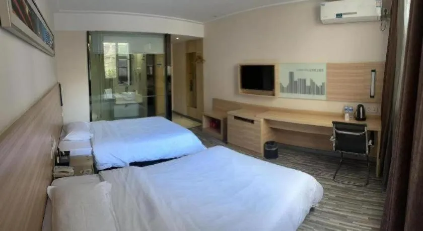 Bed in City Comfort Inn Yichang Wanda Plaza Yunhe Park