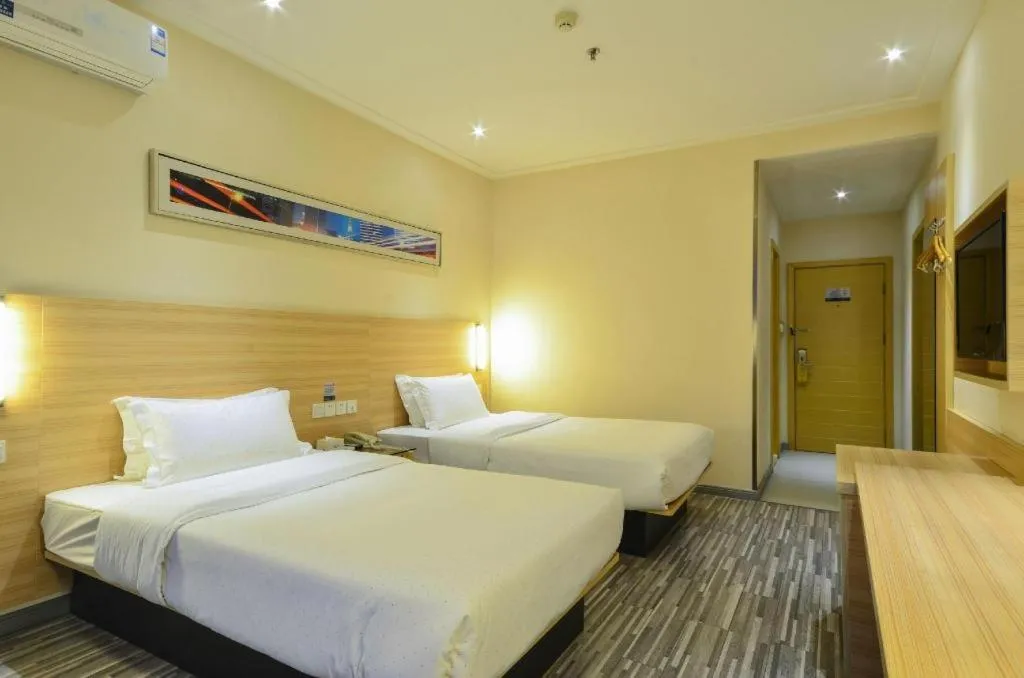 Bed in City Comfort Inn Yichang Wanda Plaza Yunhe Park