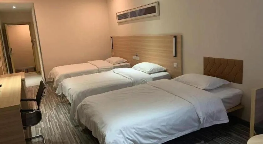 Bed in City Comfort Inn Yichang Wanda Plaza Yunhe Park