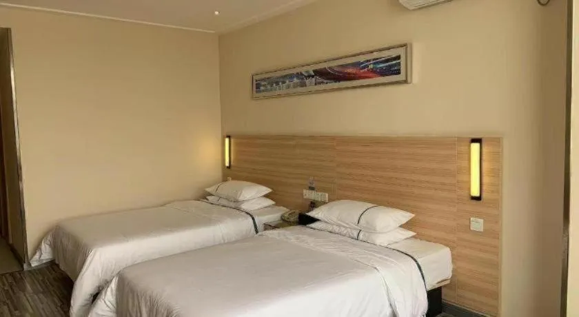 Bed in City Comfort Inn Yichang Wanda Plaza Yunhe Park