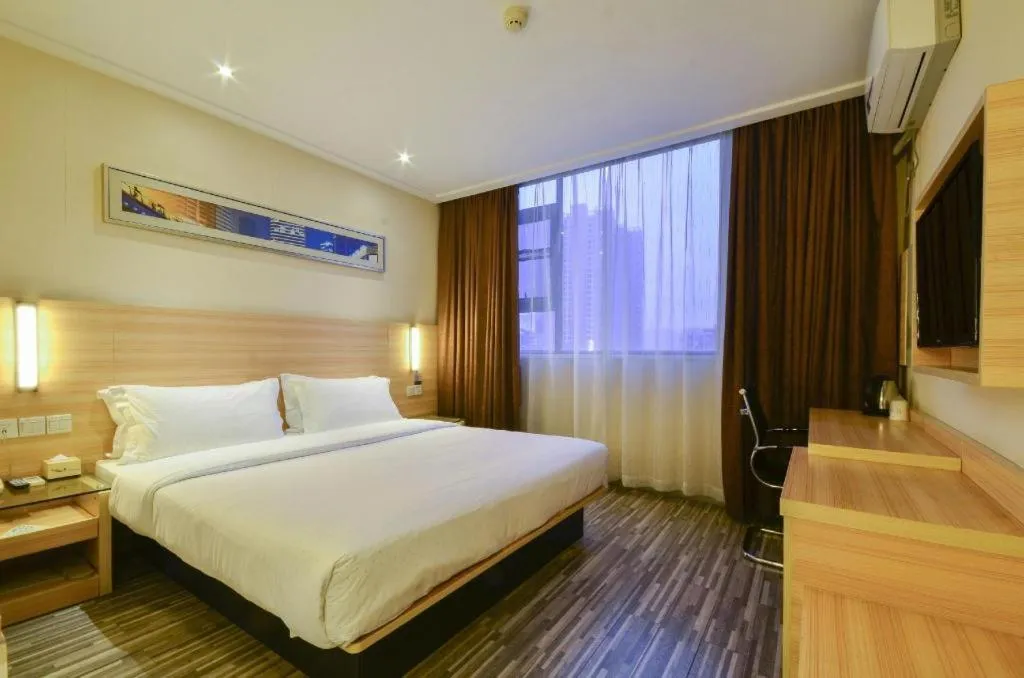 Bed in City Comfort Inn Yichang Wanda Plaza Yunhe Park