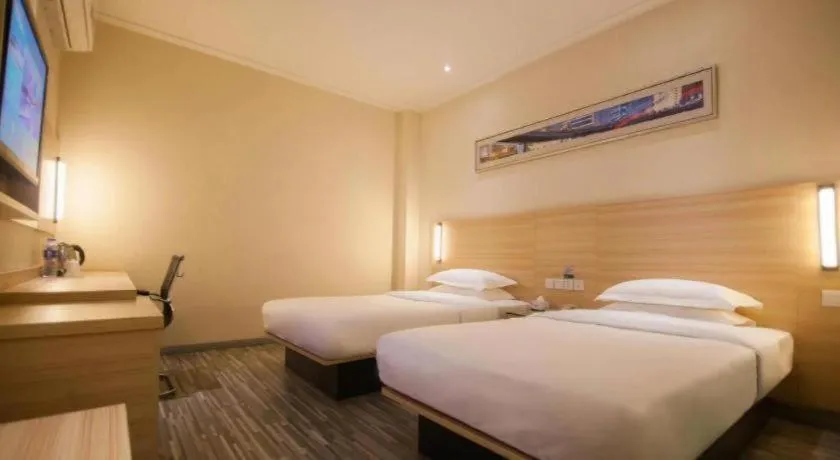 Bed in City Comfort Inn Yichang Wanda Plaza Yunhe Park