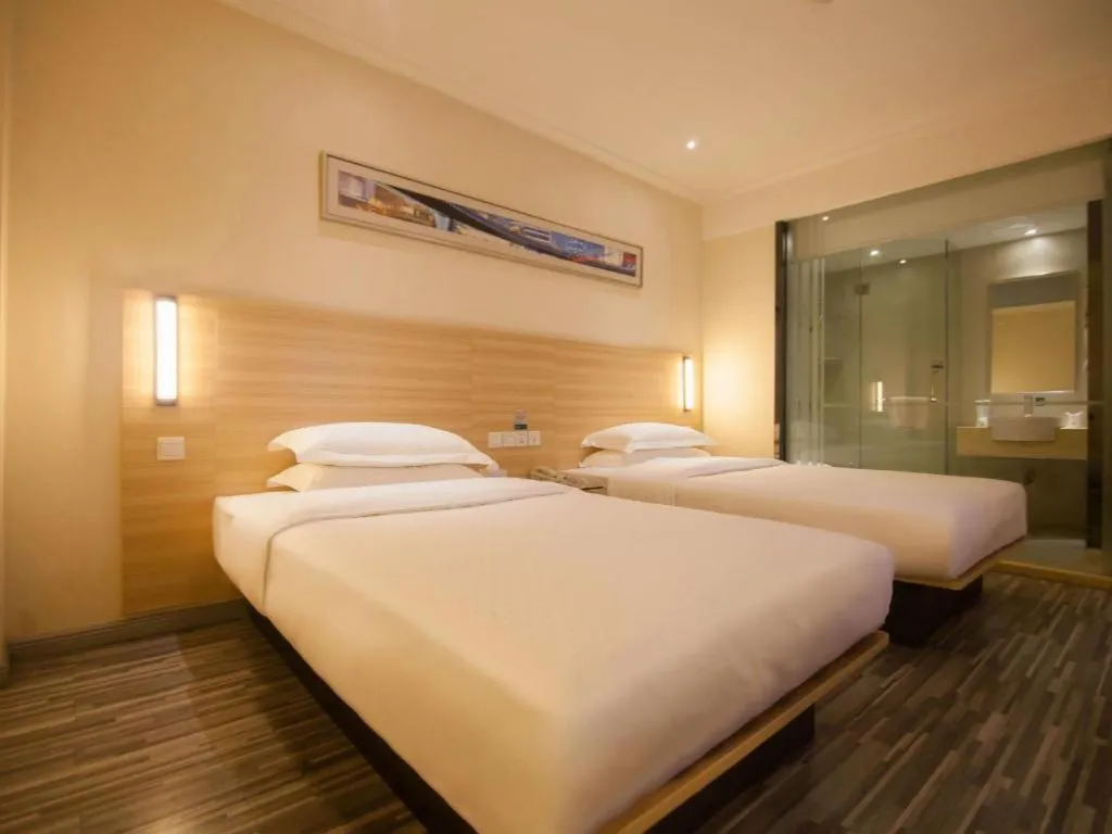 Bed in City Comfort Inn Yichang Wanda Plaza Yunhe Park