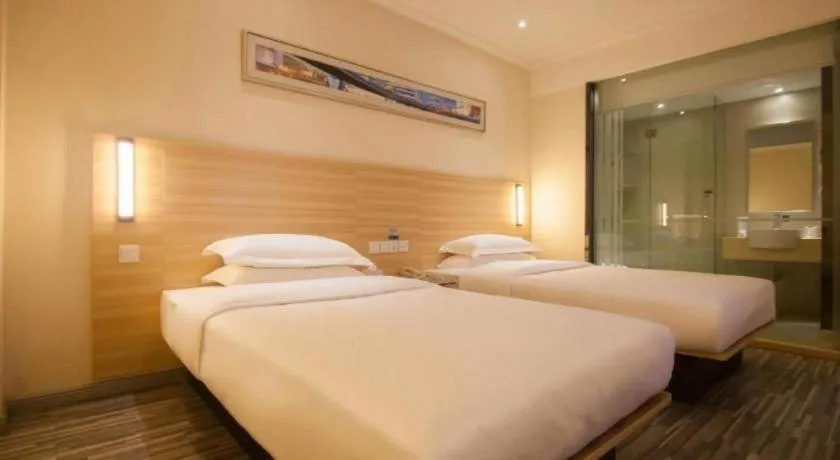 Bed in City Comfort Inn Yichang Wanda Plaza Yunhe Park