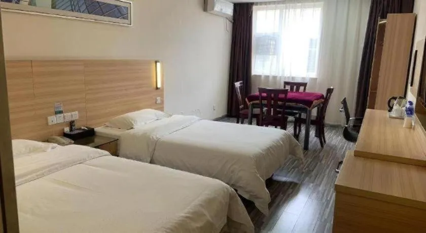 Bed in City Comfort Inn Yichang Wanda Plaza Yunhe Park