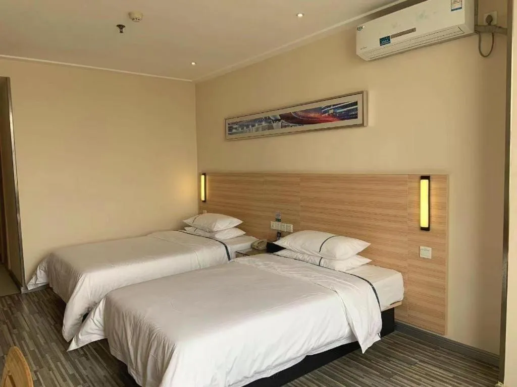 Bed in City Comfort Inn Yichang Wanda Plaza Yunhe Park