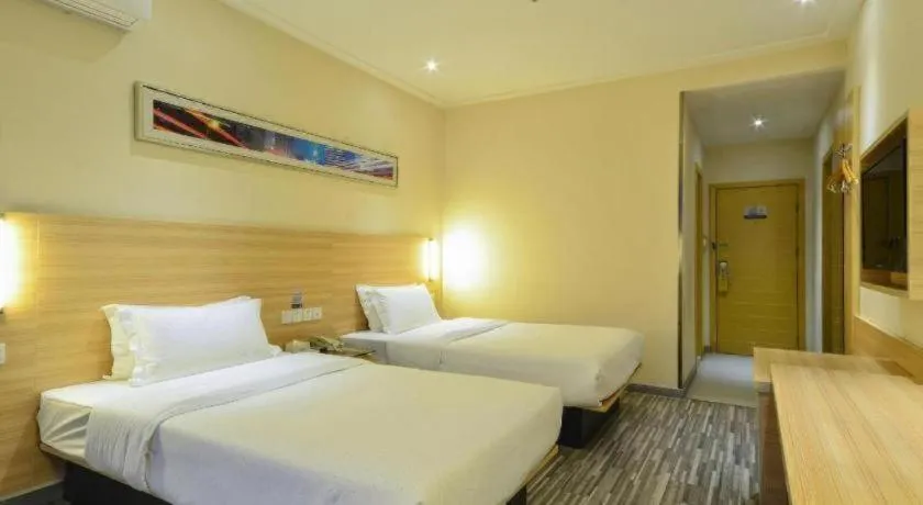 Bed in City Comfort Inn Yichang Wanda Plaza Yunhe Park