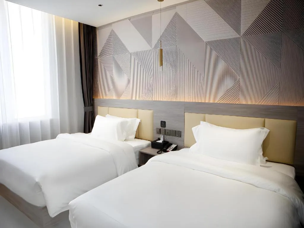 Bed in Borrman Hotel Pingyi Beifang Shicaicheng Mingde Road