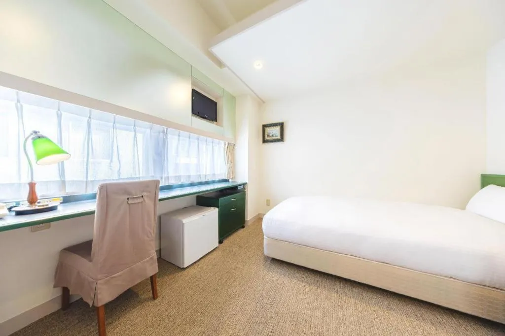 Bed in Ginza Bellevue Hotel